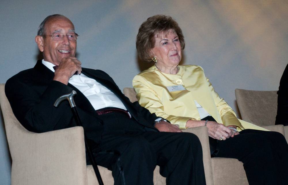 Richard and Helen DeVos sitting together at an event.